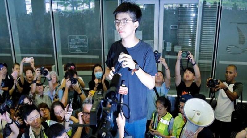 Hong Kong police arrest leading democracy activist Joshua Wong