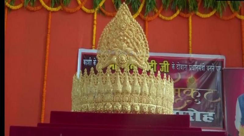 An ardent fan of Prime Minister Narendra Modi offered a gold crown weighing 1.25 kg to Lord Hanuman at Sankat Mochan Temple in Varanasi to mark Prime Minister Narender Modis 69 th birthday. (Photo: ANI)