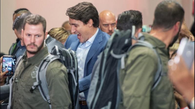 Canadian Prime Minister Justin Trudeau donned an armored vest and appeared with a heavy security detail at a major election rally on Saturday. (Photo: AP)