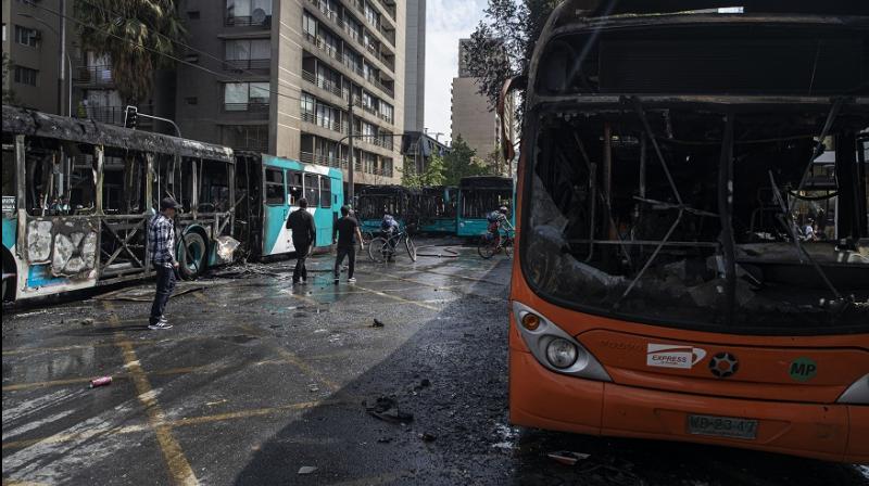 Chile\s President rolls back subway fare hike amid violent protests by students