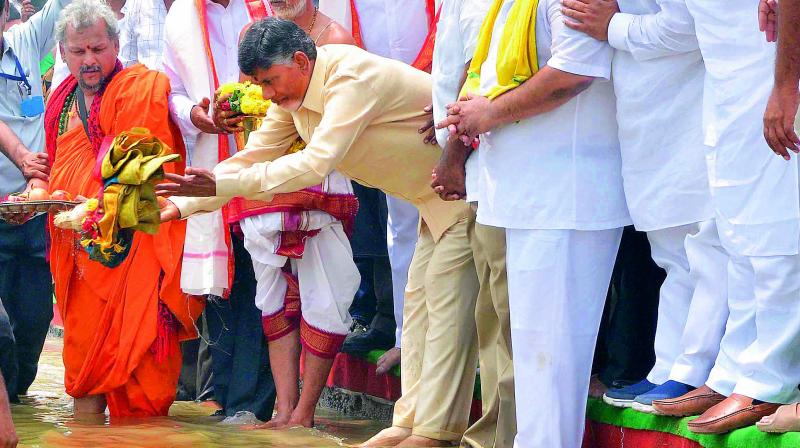 A file photo of Chief Minister N. Chandrababu Naidu performing puja at the Krishna and Godavari river linking at Pavitra sangamam near Vijayawada.