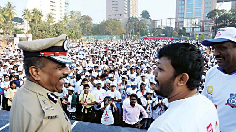 Over 7,000 students take part in an anti-drugs walkathon (left) Commissioner T. Suneel Kumar with actor Ganesh.