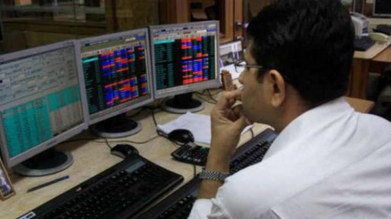 Sensex drops over 200 points; RIL soars 8 per cent
