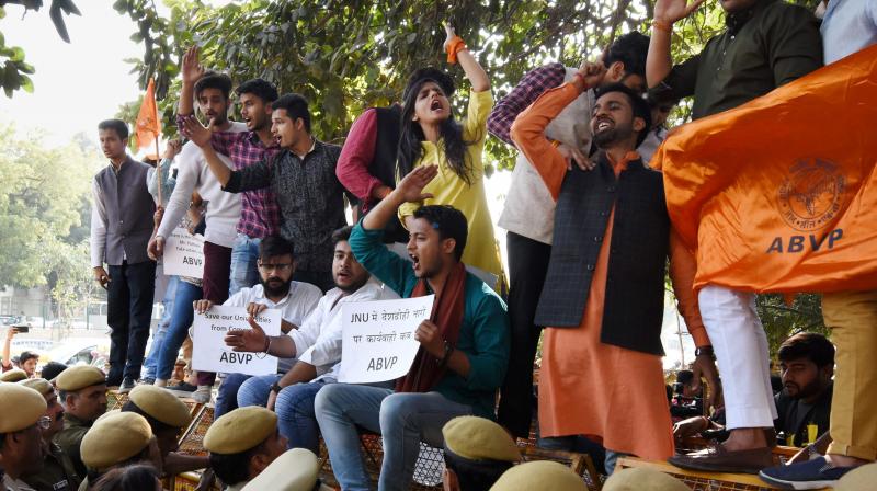 Akhil Bharatiya Vidyarthi Parishad (ABVP) activists during a protest against Delhi Police at Police headquarters in New Delhi on Wednesday. The activists alleged that appropriate action was not taken in the JNUs anti-India slogans case. (Photo: PTI)