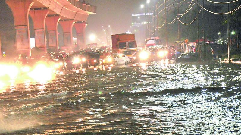 A sudden downpour causes a huge traffic jam on the Nagole to Uppal Ring Road on Sunday. (Photo: DC)