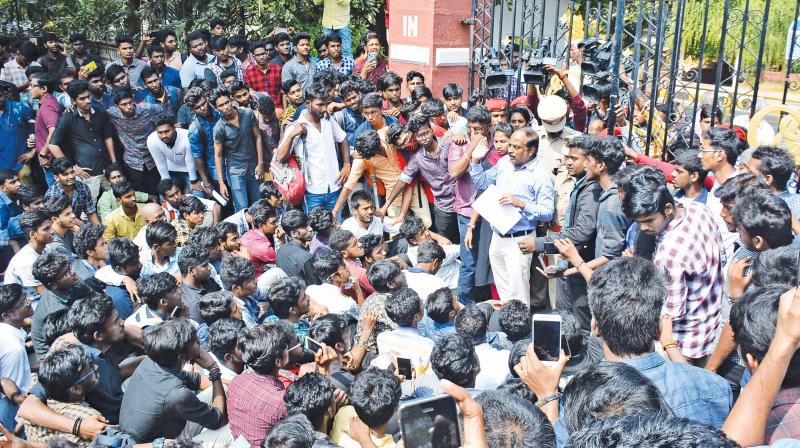 Anna University registrar J. Kumar addressing the protesting engineering students outside the university campus in Guindy on Friday. (Image DC)