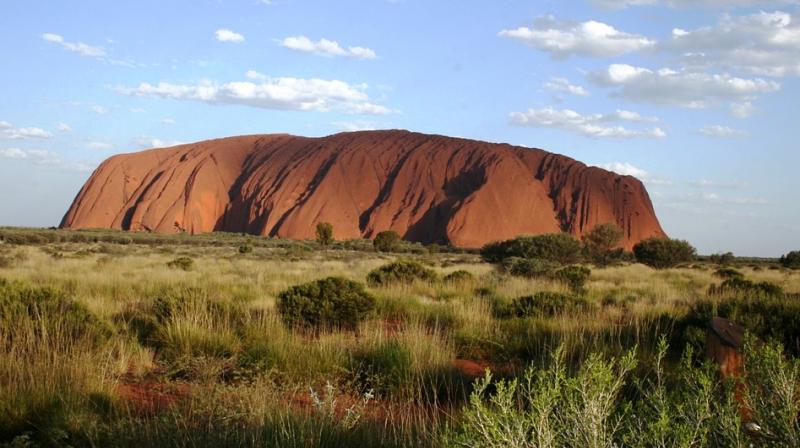 Uluru faces an influx of tourists after imposing ban on climbing