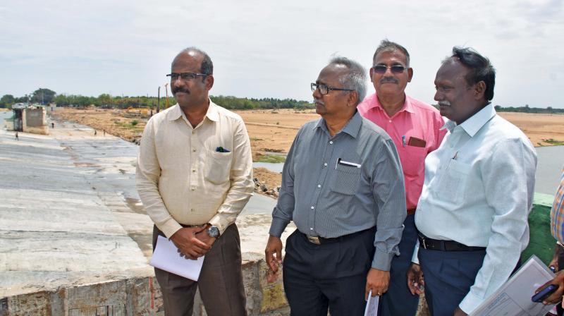Satyagopal accompanied by Tiruchy Collector S.Sivarasu and others inspecting the ongoing works at MUkkombu near Tiruchy on Friday. (Photo: DC)