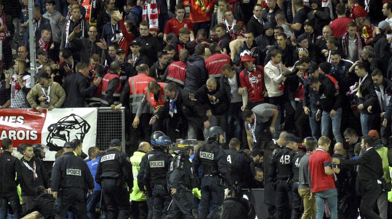 Twenty-nine fans were hurt, five of them seriously, when a barrier collapsed Saturday at a stadium in the northern French city of Amiens as away supporters celebrated their opening goal. (Photo: AP)