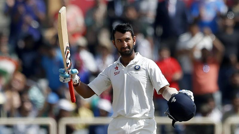 Cheteshwar Pujara has reason to celebrate as his knock of 202 has helped him gain four slots to reach a career-best second ranking with 861 points. (Photo: AP)