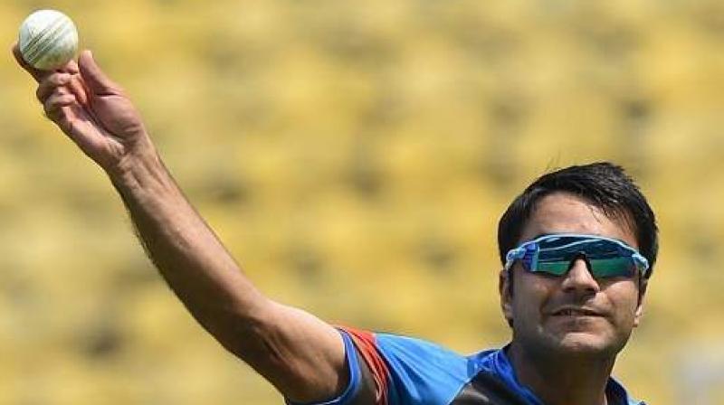Known to fox the batsmen with his googly and accurate quicker ones, Rashid Khan, who is among the many die-hard Bollywood fans in Afghanistan, has modelled himself on Pakistan star Shahid Afridi and favourite Indian player is none other than MS Dhoni. (Photo: AFP)