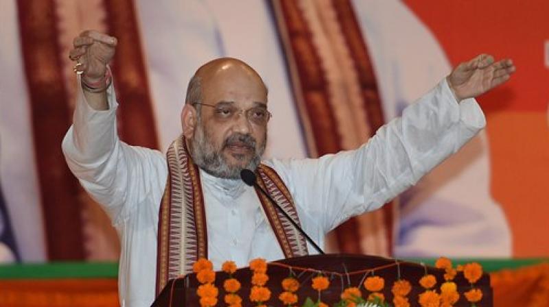 BJP National President Amit Shah addresses the partys Intellectuals Meet in Lucknow on Sunday. (Photo: PTI)