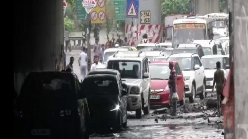Delhi: Water logging due to rains paralyses life in national capital