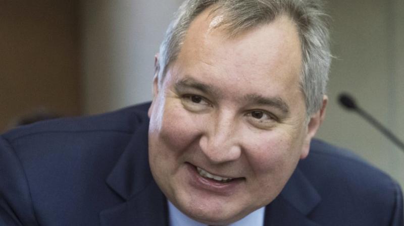 Russian Deputy Prime Minister Dmitry Rogozin smiles before Russian Prime Minister Dmitry Medvedevs annual report on countrys economic and social development in the State Duma, the Lower House of the Russian Parliament, in Moscow, Russia. (AP Photo/Pavel Golovkin, File)