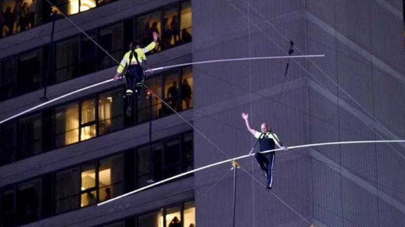 Watch: â€˜Flying Wallendasâ€™ cross Times Square on high wire in death-defying stunt