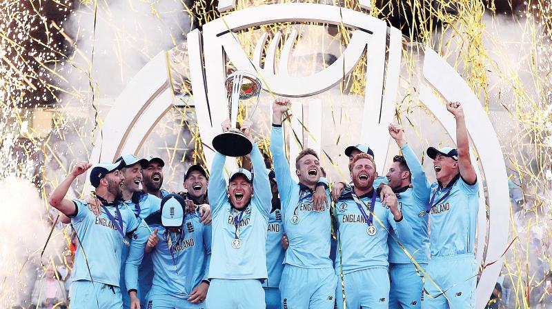 England players celebrate a New Zealand wicket during the World Cup final at Lords Cricket Ground in London on Sunday. (AFP)