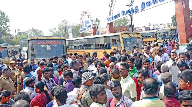 Over 300 people blocked the road at the Periyar bus stand, Madurai, on Saturday in protest against bus fare hike. With traffic affected for nearly an hour, the police tried to disperse the crowd but the protesters resisted. Police took five persons into custody and had to literally drag them to the police van. The  situation came under control after this (Photo: K .Manikandan)