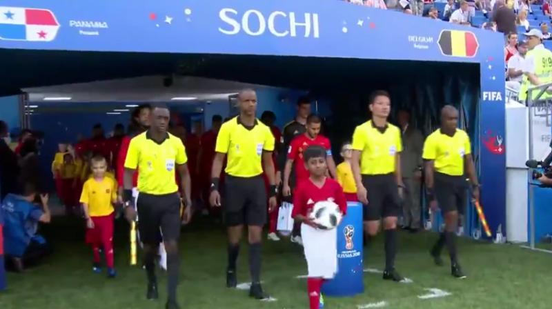 Rishi (centre) made history last night when he carried the ball to the field before the start of Belgium vs Panama game in Sochi. (Photo: screengrab)