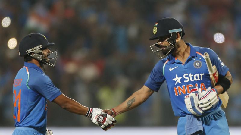 Kedar Jadhav and Virat Kohli played a crucial role, putting up a 200-run partnership, to chase down the mammoth total of 351 set by England in Pune. (Photo: AP)