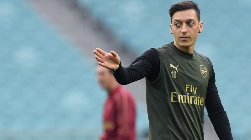 Ozil was with his teammate Sead Kolasinac when the incident took place. (Photo: AFP)