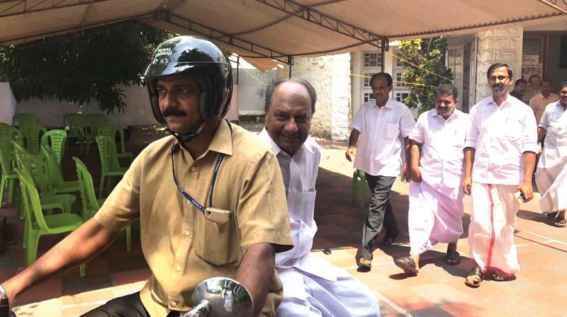 Congress Working Committee member A.K. Antony reaches the KPCC office on a bike due to hartal on Monday.