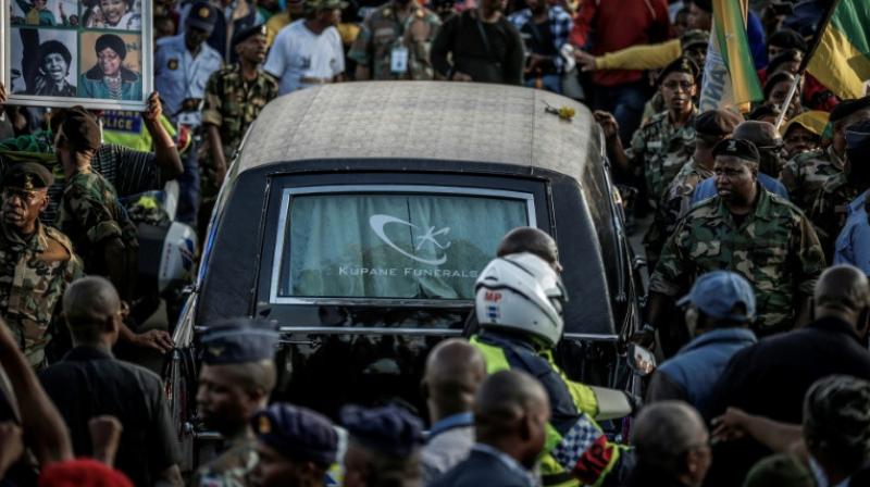 Mourners lined the streets of Soweto as the hearse carrying the body of the anti-apartheid icon returned to her home. (Photo: AFP)