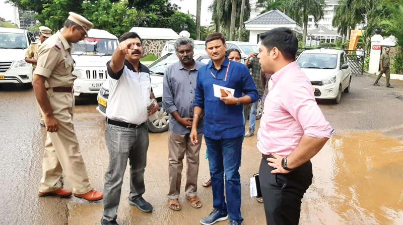 PWD principal secretary G. Kamalavardhana Rao and district collector S. Suhas review the poor road condition and traffic issues at Kundanoor junction on Saturday.  (DC)
