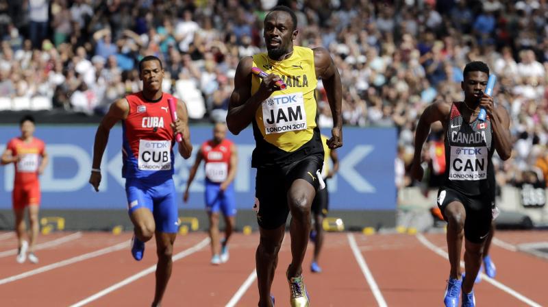 Tyquendo Tracey, Julian Forte and Michael Campbell safely negotiated the first three legs before Bolt steered his team home in a winning, seasons best of 37.95 seconds.(Photo:AP)
