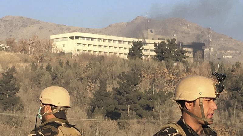 Smokes rises from the Intercontinental Hotel after an attack in Kabul, Afghanistan. (Photo: AP)