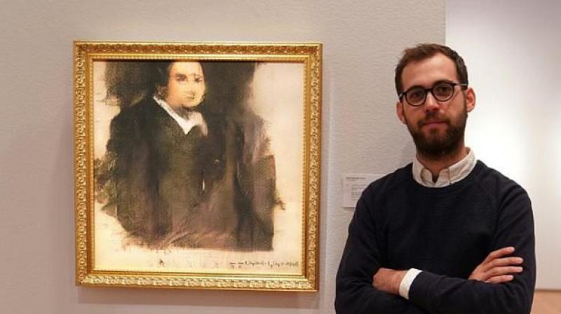 The signature on the painting is an algorithm that was actually used to create the artwork (Photo: AFP)