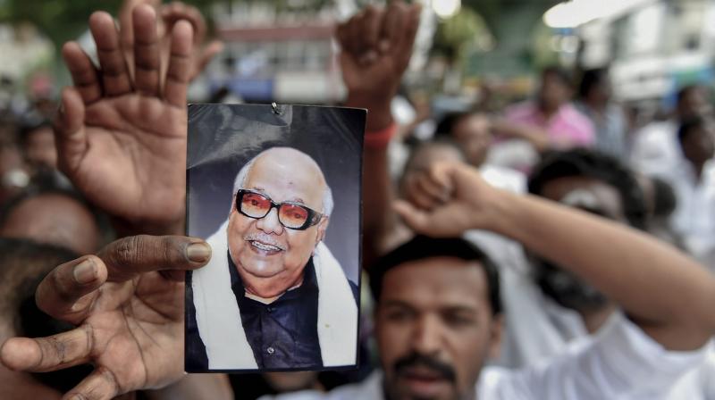 Supporters gather outside the hospital, where DMK chief M Karunanidhi is being treated, in Chennai. (Photo: PTI)