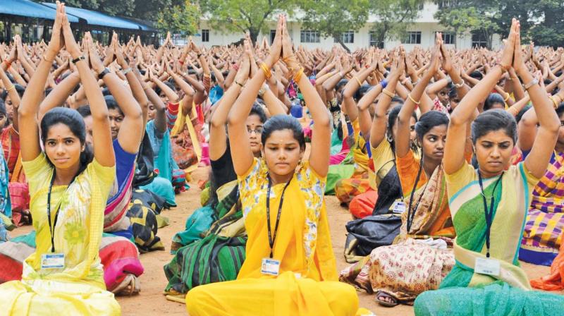 Students of Valliammal  college for women, Anna Nagar, perform yoga to mark Internationl yoga day. (Photo: DC)