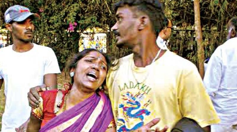 Vikram, the 6-year-old victim, his grieving mother being comforted by relatives.
