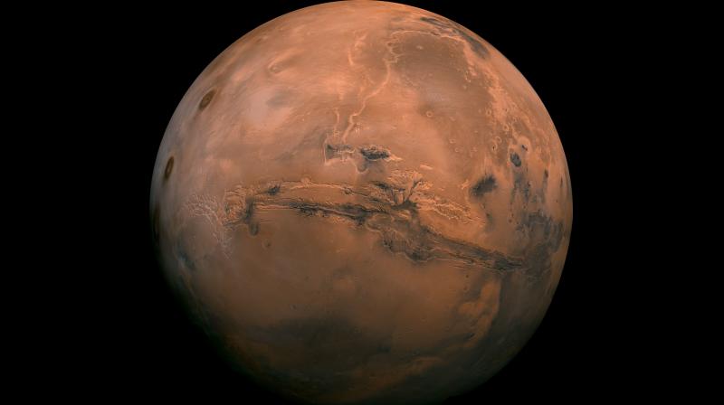 This image made available by NASA shows the planet Mars. This composite photo was created from over 100 images of Mars taken by Viking Orbiters in the 1970s. The attraction is sure to grow on Monday, November 26 with the arrival of a NASA lander named InSight. (NASA via AP, File)