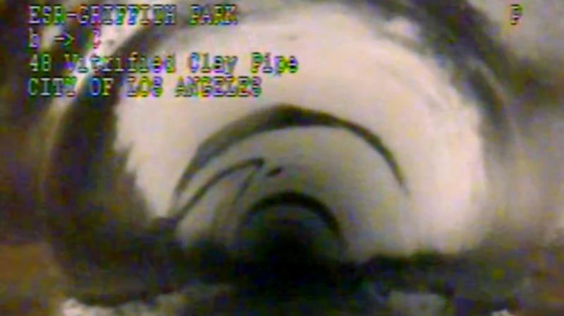 This photo from remote camera video provided by the Los Angeles Department of Sanitation shows where 13-year-old Jesse Hernandez traced an arc with his fingers, the small arc at center left, as he was swept through a 4-foot diameter pipe after falling into a hole in Griffith Park in Los Angeles, Monday, April 2, 2018. Hernandez spent more than 12 hours in the toxic environment of the sewer system before being rescued. (Photo: AP)