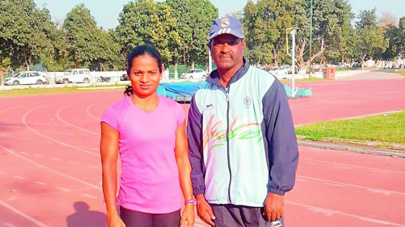 Dutee Chand (left) with coach N. Ramesh.