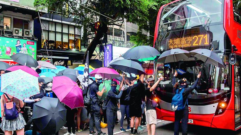 Hong Kong protesters ignore police, go past endpoint