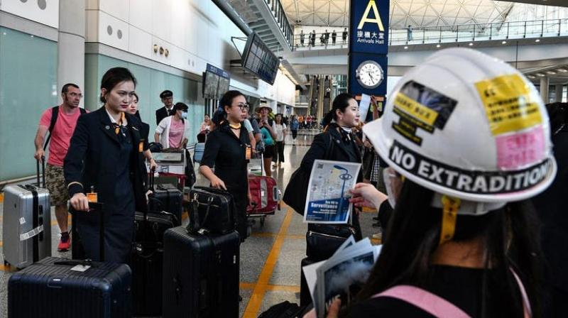 Amid protests, more than 100 flights cancelled in Hong Kong
