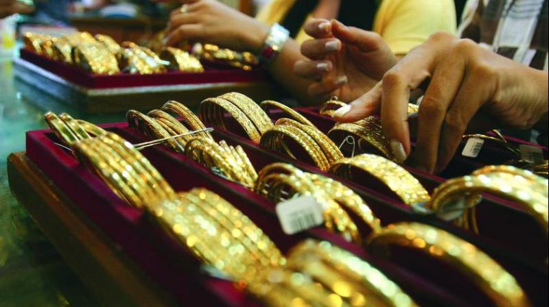 Gold loses sheen, falls Rs 425 on lacklustre demand; silver slips Rs 690