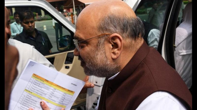 Caught on camera: Amit Shahâ€™s photo reveals Modi govt plan, goes viral