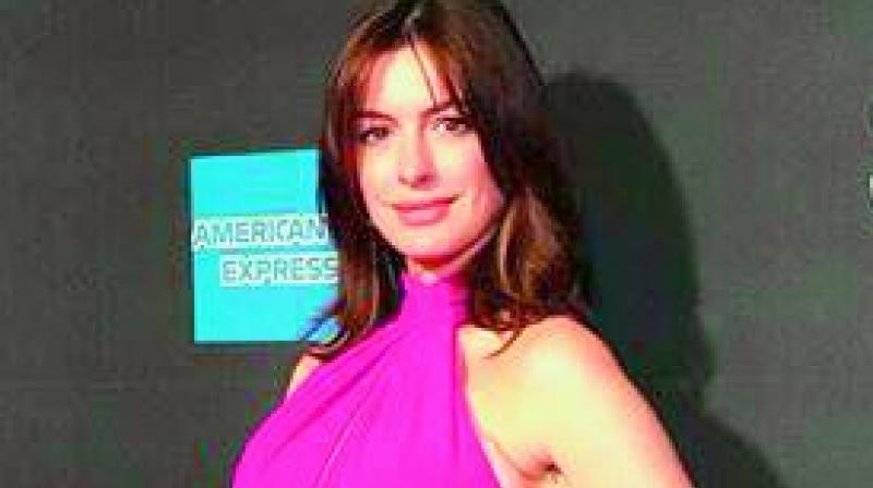 Anne Hathawayâ€™s baby bump debuts on the red carpet