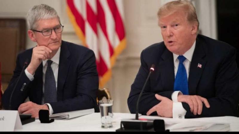 US President Donald Trump said he was having dinner on Friday with Chief Executive Officer Tim Cook of Apple Inc, a company the president has criticised for not manufacturing more of its products in the United States. (Photo: AFP)