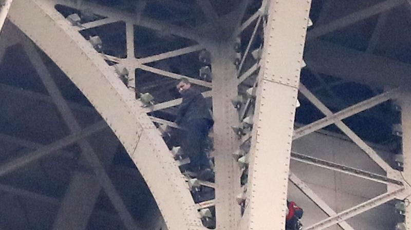 Police have made contact with the climber but do not yet know why he began his ascent up the iron beams. (Photo:AP)