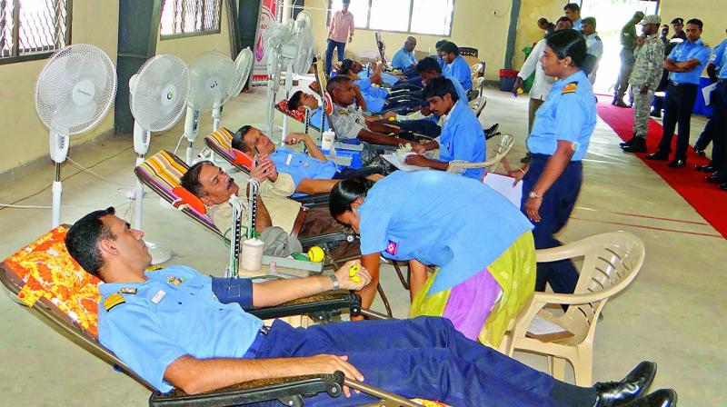 Navy personnel take part in a blood donation camp as part of 31st Anniversary of INS Kalinga at Bheemunipatnam in Visakhapatnam on Friday.  (Photo: DC)