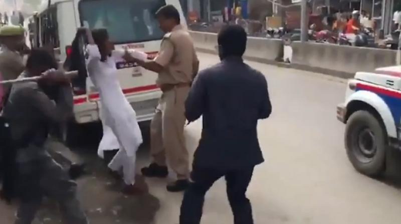 Watch: Male cops pull girl students hair for blocking Amit Shahs convoy