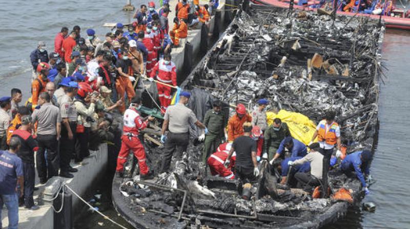 The Zahro Express was carrying at least 247 people, mostly Indonesians celebrating the New Years holiday, from Muara Angke port in northern Jakarta to the resort island of Tidung when it caught fire. (Photo: AP)