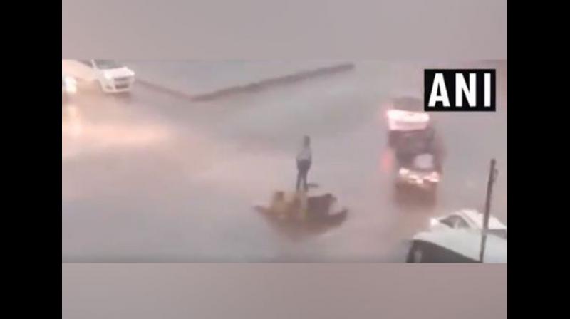 Watch: Assam traffic cop carry out duty in heavy downpour, becomes social media star
