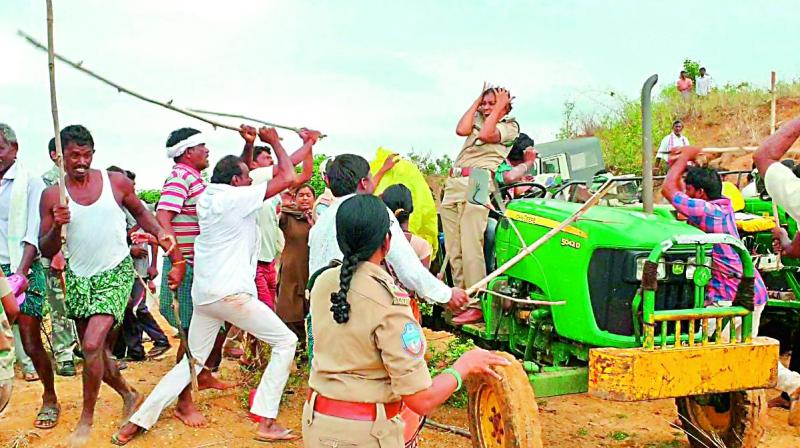 TRS activists beat up woman forest officers, staff with sticks, poles