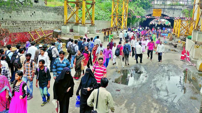 Oliphanta bridge has been closed for traffic, forcing people to walk through a dirty water-filled stretch. (Photo: DC)