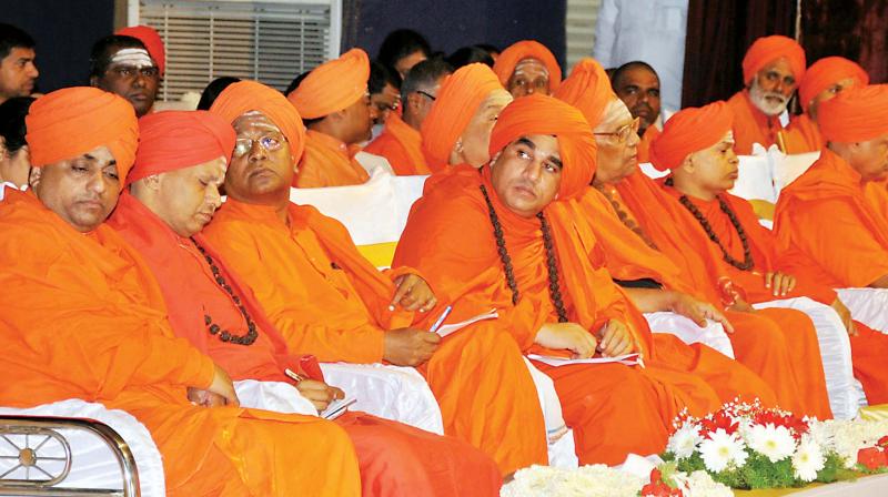 Lingayat seers at a meeting on separate religion tag to the community in Bengaluru on Thursday.